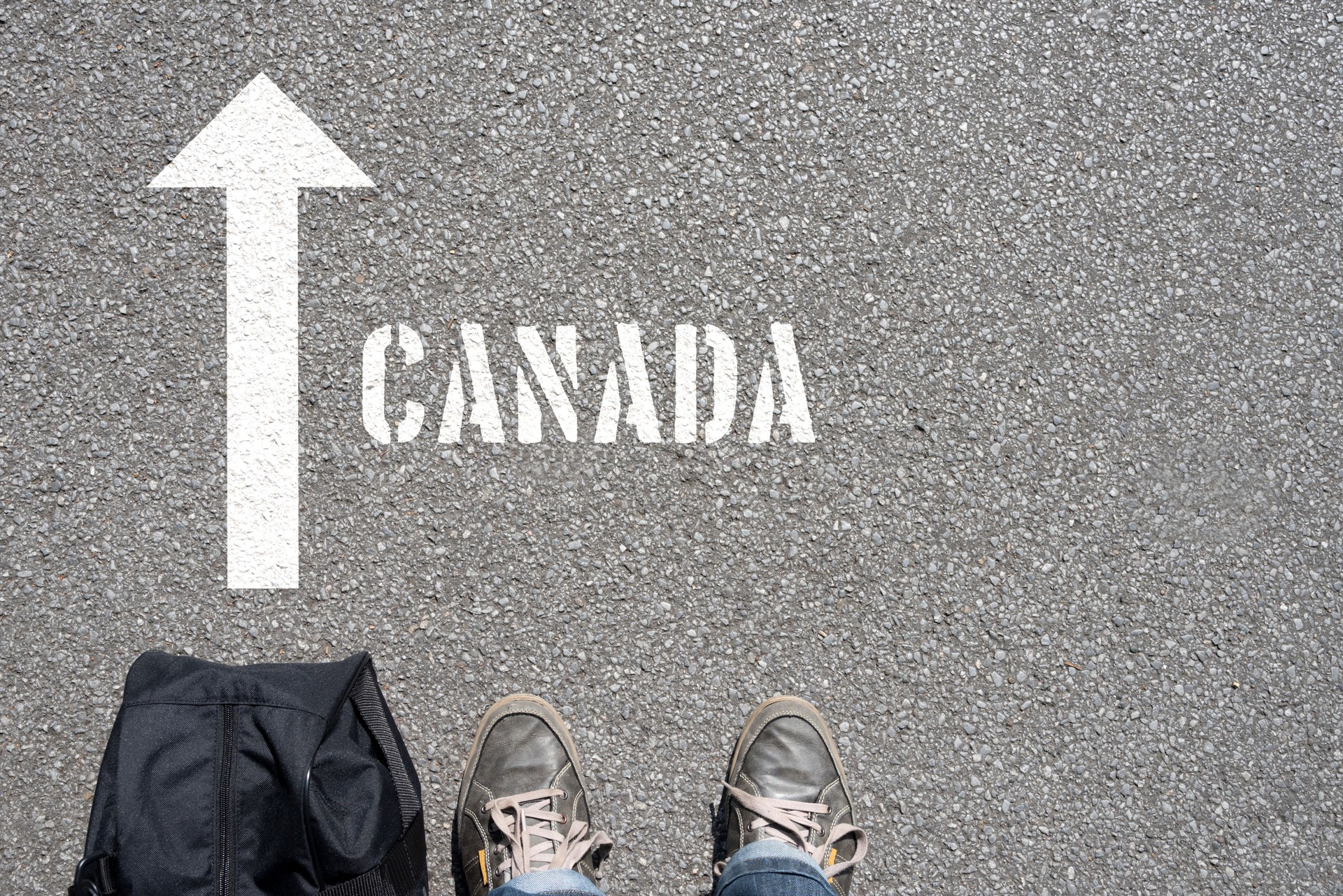 A man with a travel bag on his way to Canada